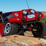 OME 4 inch Lift Kit installed of a red Jeep Wrangler JK 2007-2015 another view