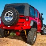 OME 4 inch Lift Kit installed of a red Jeep Wrangler JK 2007-2015 back