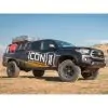 0-2.75 inch Lift Kit by ICON on a black 2016 Toyota Tacoma - side view